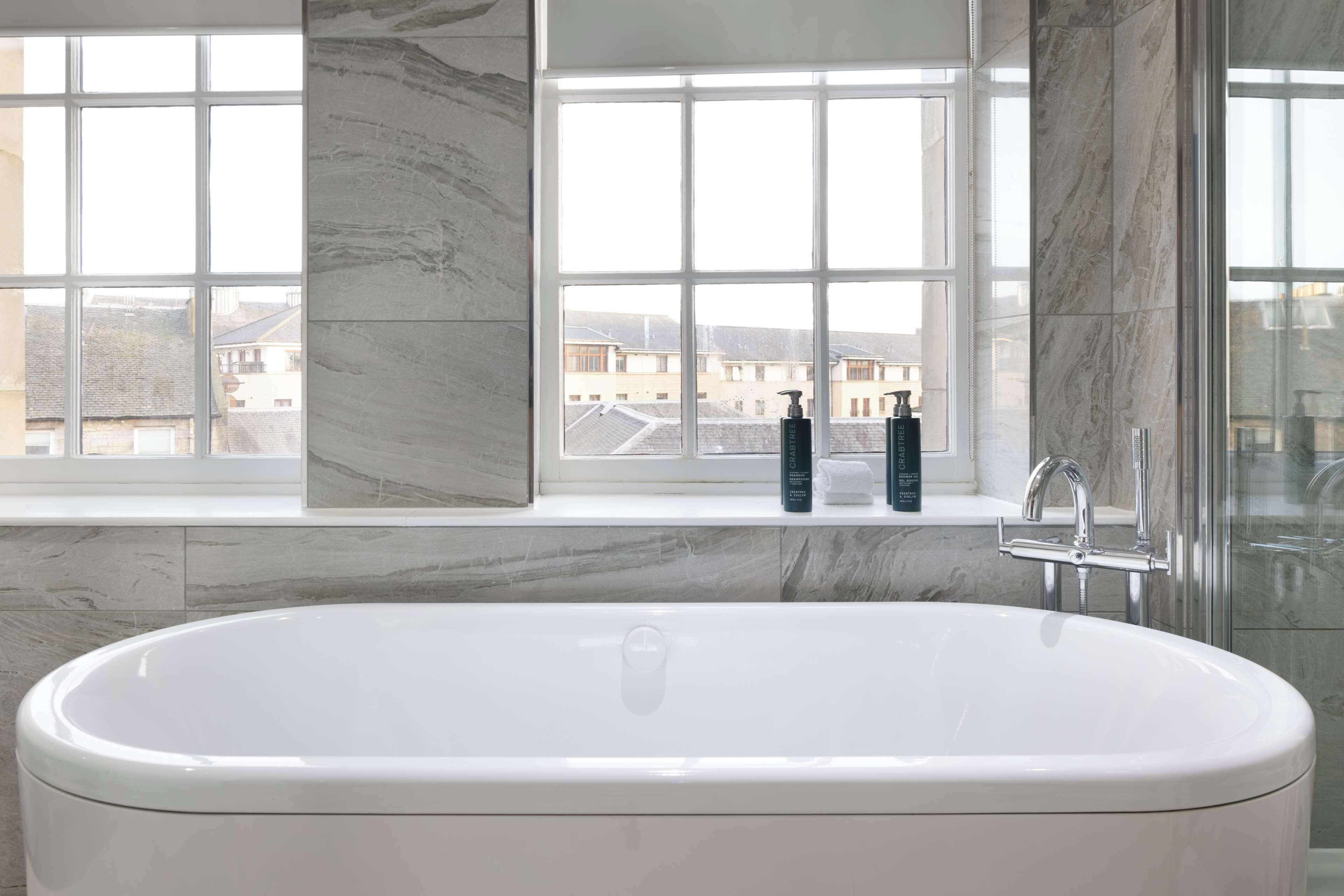 suite, 1 bedroom (castle view) | bathroom | combined shower/bathtub, free toiletries, hair dryer, towels