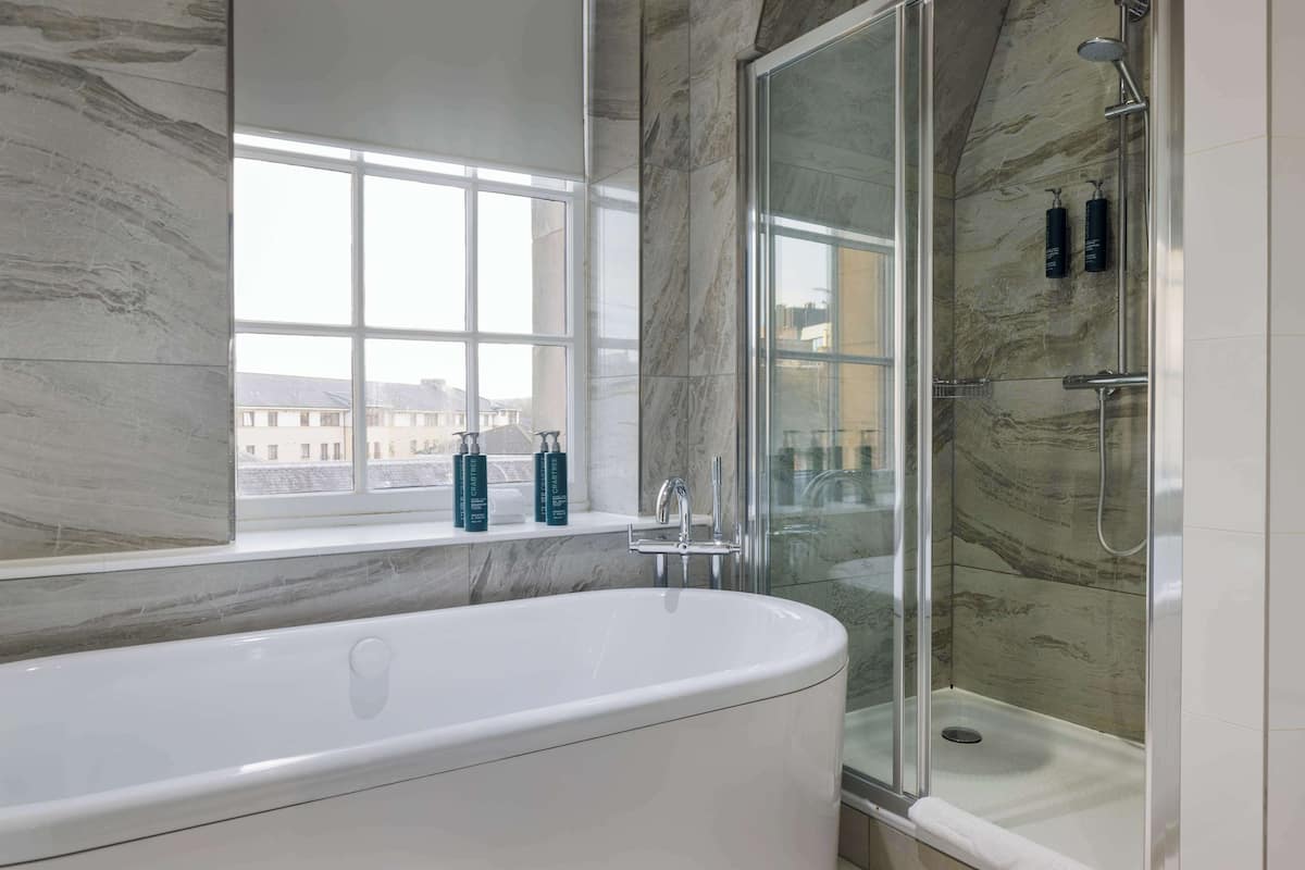 suite, 1 bedroom (castle view) | bathroom | combined shower/bathtub, free toiletries, hair dryer, towels