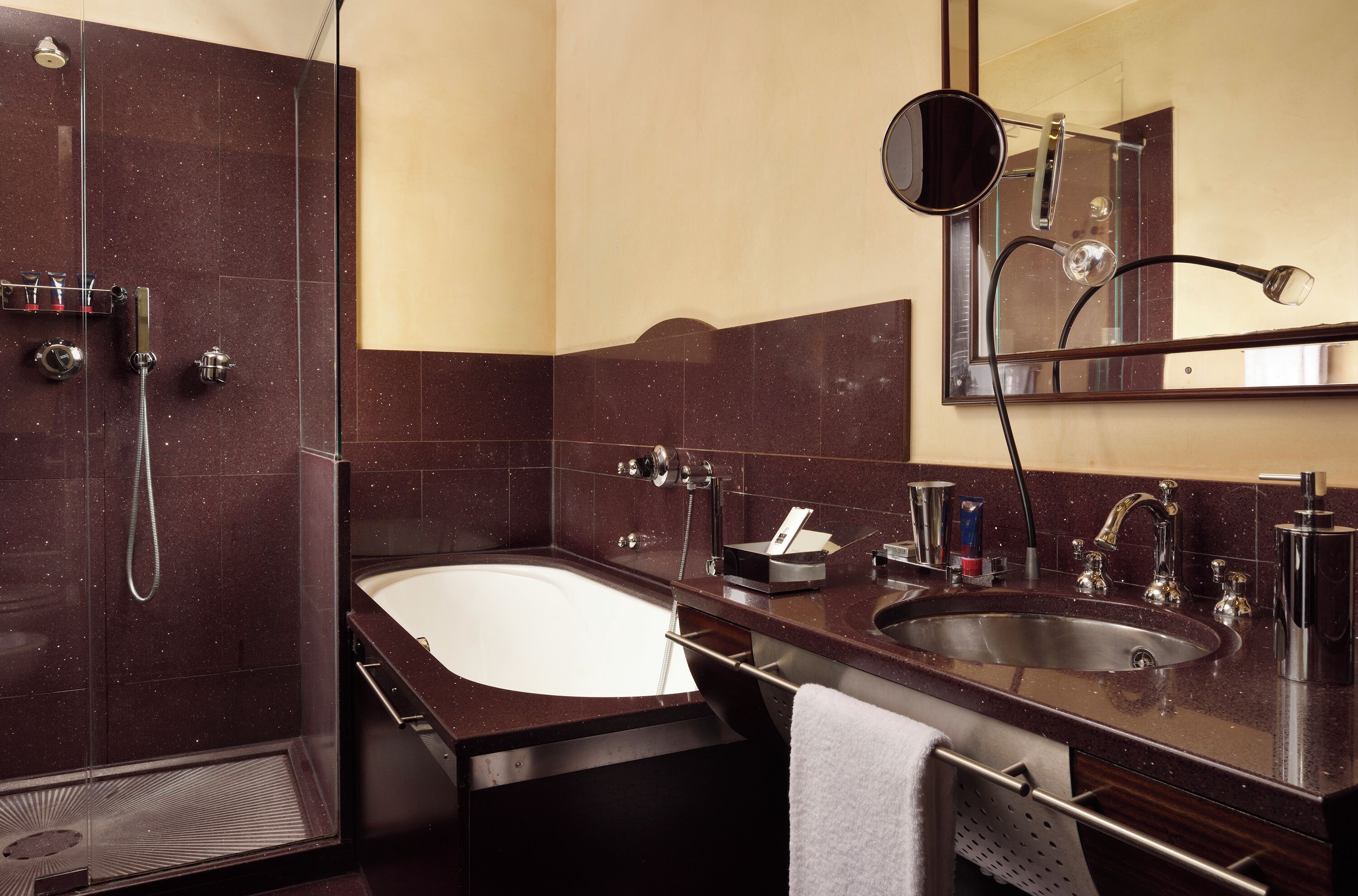 A modern bathroom with a walk-in shower, a freestanding bathtub, and a sink with a vanity.