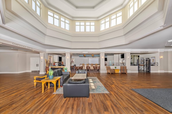A spacious interior with a conference center, lounge, and restaurant areas.