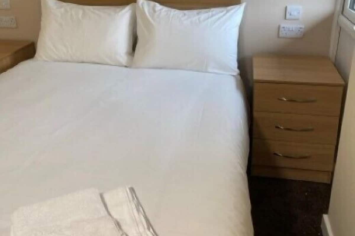 Desk, laptop workspace, free WiFi, bed sheets