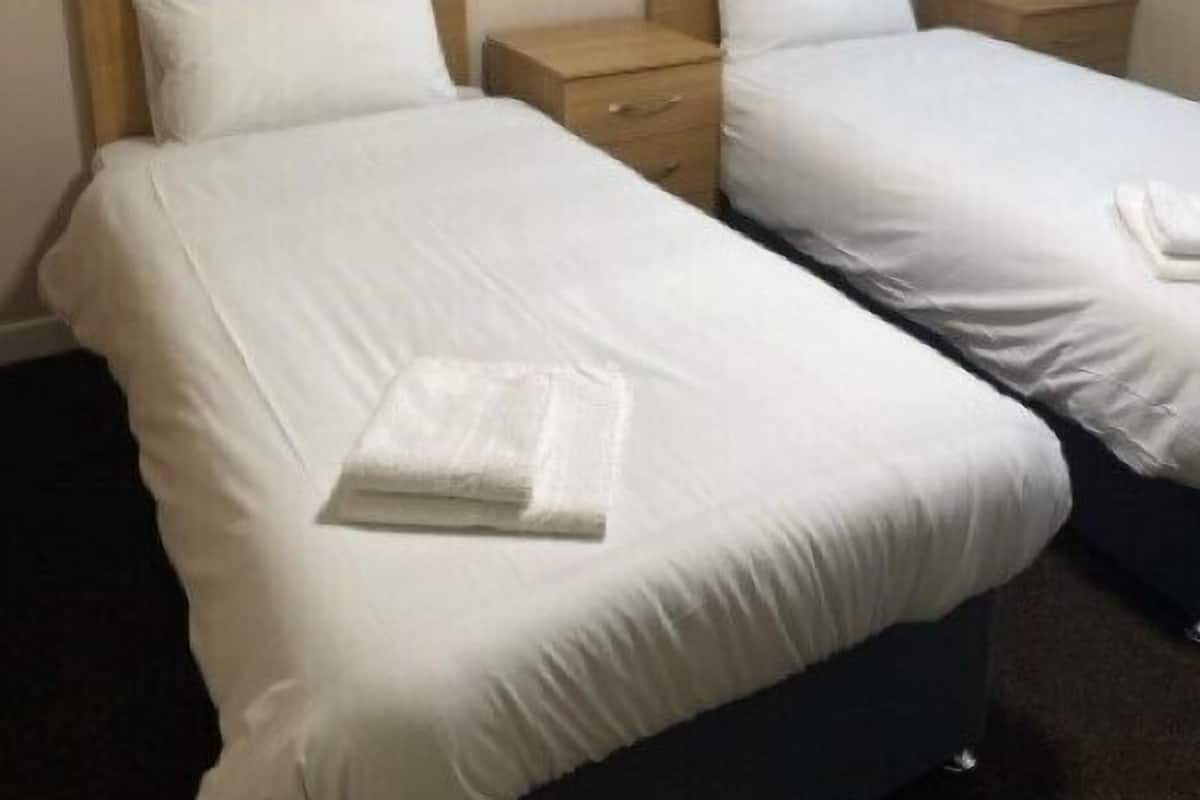 Desk, laptop workspace, free WiFi, bed sheets