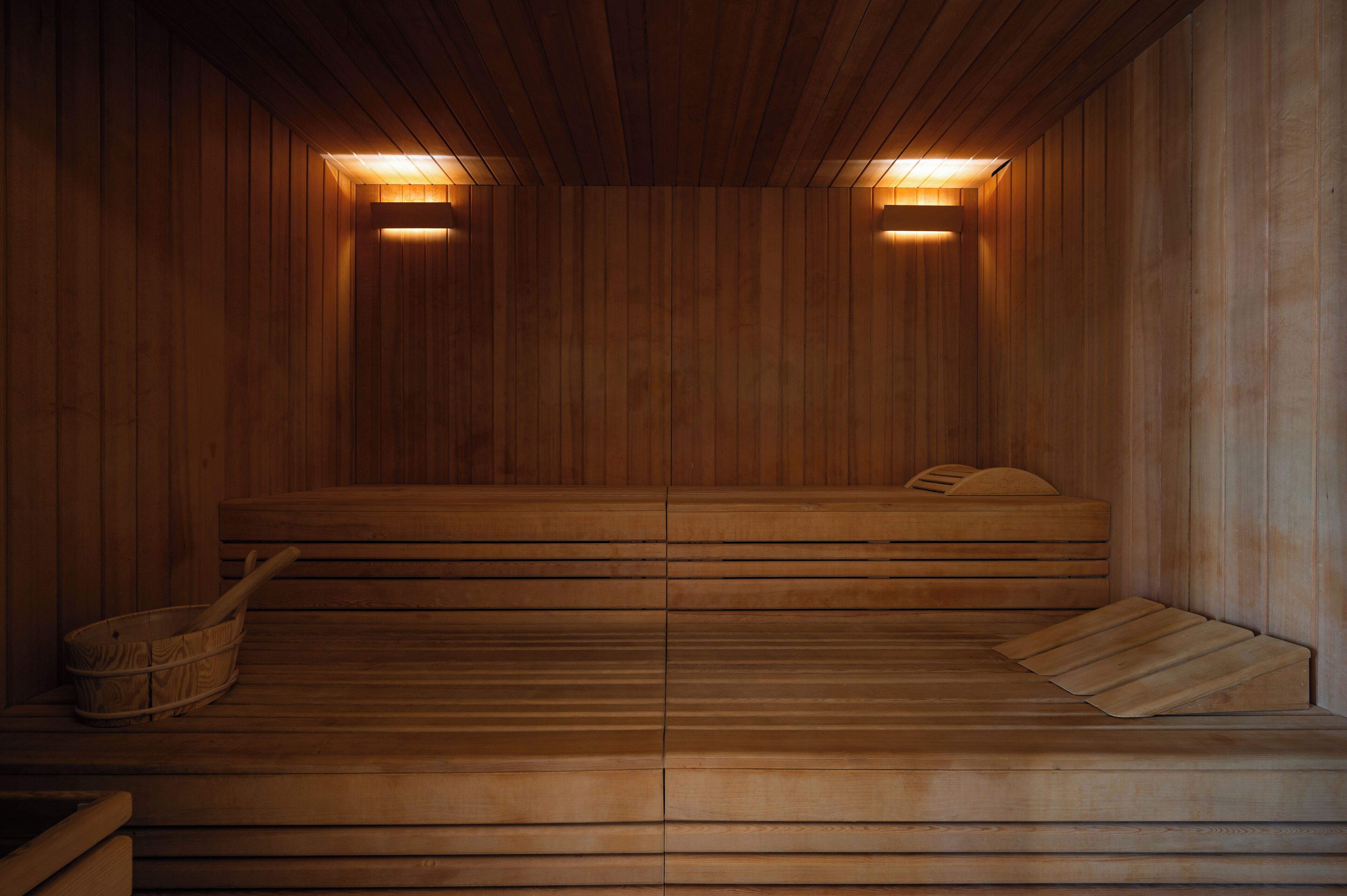 A wooden sauna with benches and benches.