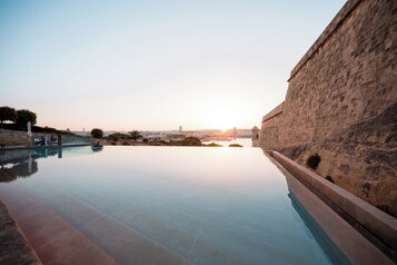 Indoor pool, outdoor pool, pool umbrellas, sun loungers