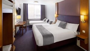 A hotel room with two beds, a desk, a chair, a TV, and a window with curtains. -  Casa Mere Hotel, Sure Collection by Best Western, Knutsford Cheshire (Knutsford)