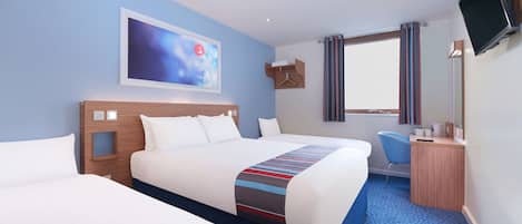 A hotel room with two beds, a desk, a chair, a TV, and a window with curtains.