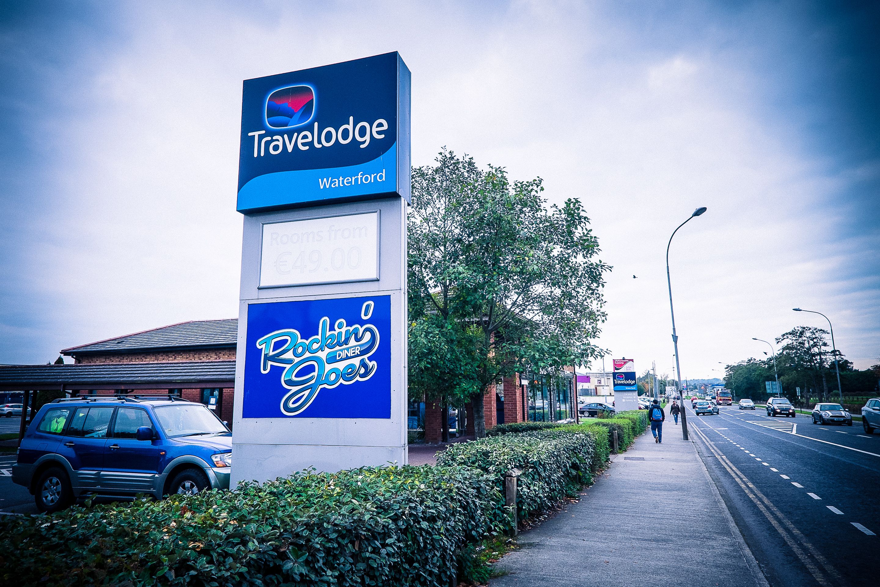 A Travelodge sign with a 'Rockin' Goes' advertisement.
