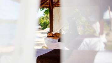 Relax in a serene garden setting with a shaded hammock and lush greenery.