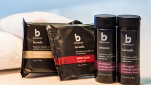 A set of toiletries including a facial soap, conditioner shampoo, and a body wash.