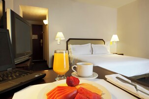 Superior Room King | Hypo-allergenic bedding, in-room safe, desk, iron/ironing board