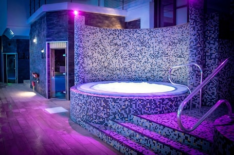 Indoor pool, sun loungers. Village Hotel Nottingham