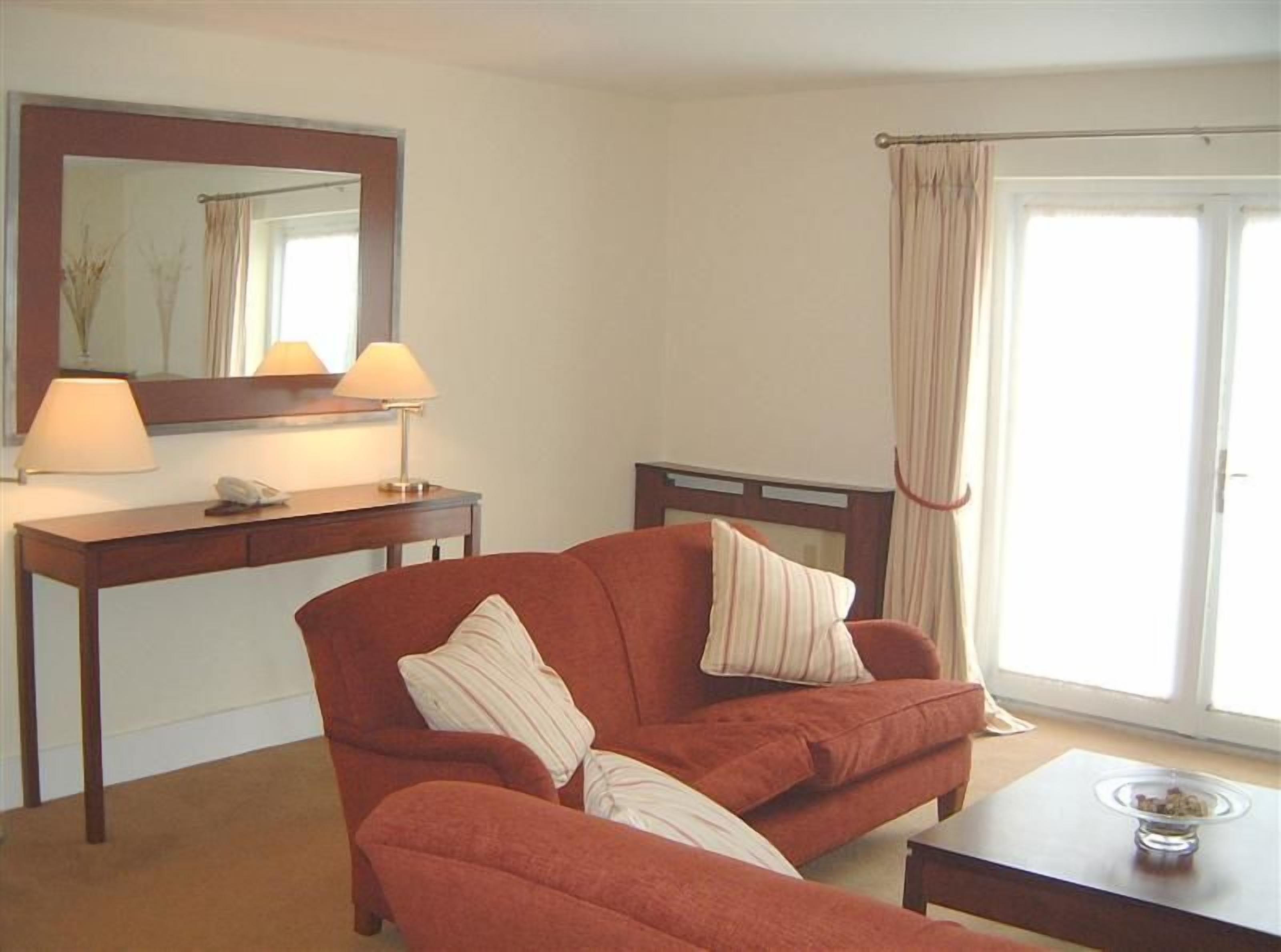 suite, 2 double beds, garden view | living area | 32-inch flat-screen tv with cable channels, tv