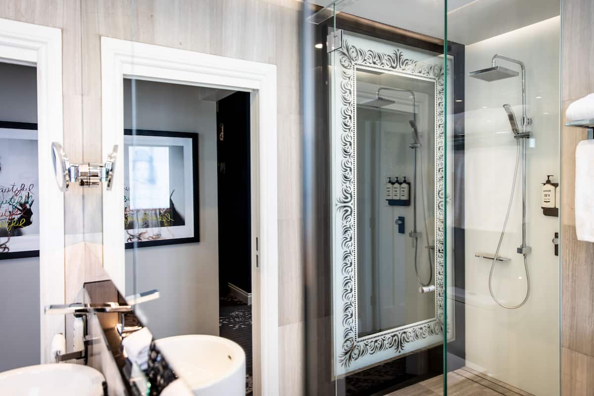 2 bedroom heritage suite | bathroom | shower, rainfall showerhead, designer toiletries, hair dryer