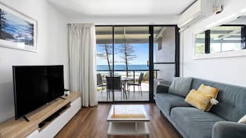 1 Bedroom Ocean View Apartment | Living area | 32-inch flat-screen TV with cable channels, TV