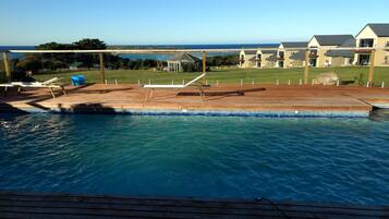 Seasonal outdoor pool, pool loungers