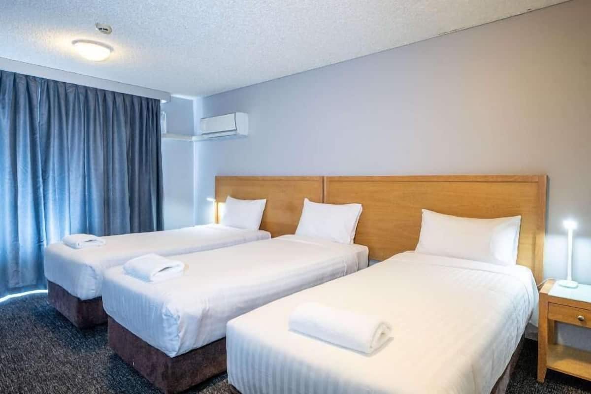 Premium bedding, laptop workspace, blackout curtains, iron/ironing board