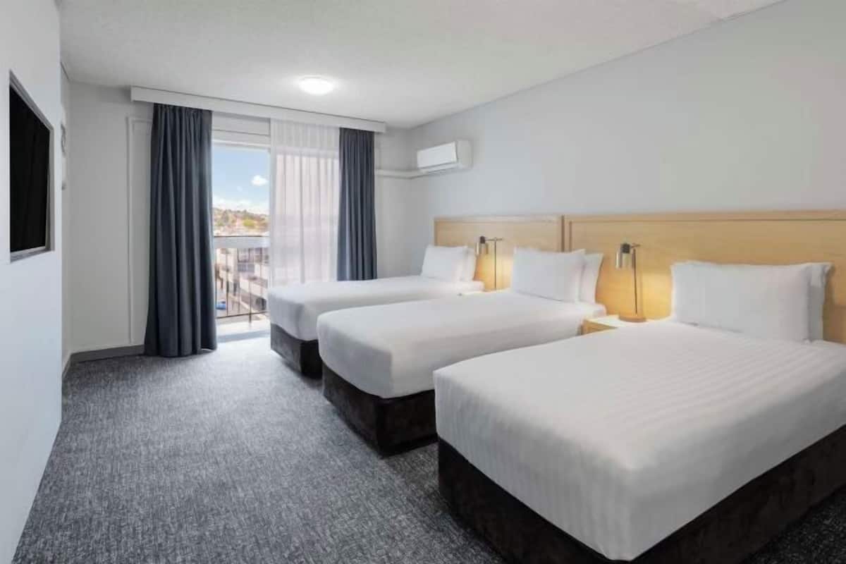 Premium bedding, laptop workspace, blackout curtains, iron/ironing board