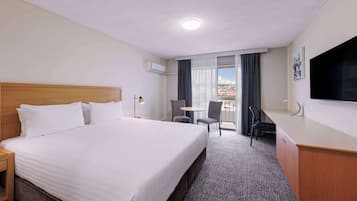 Premium bedding, laptop workspace, blackout drapes, iron/ironing board