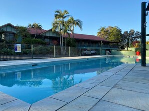 Outdoor pool, open 7:00 AM to 8:00 PM, pool loungers