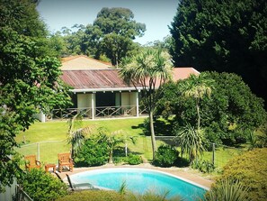 Outdoor pool, open 7:00 AM to 8:00 PM, pool loungers