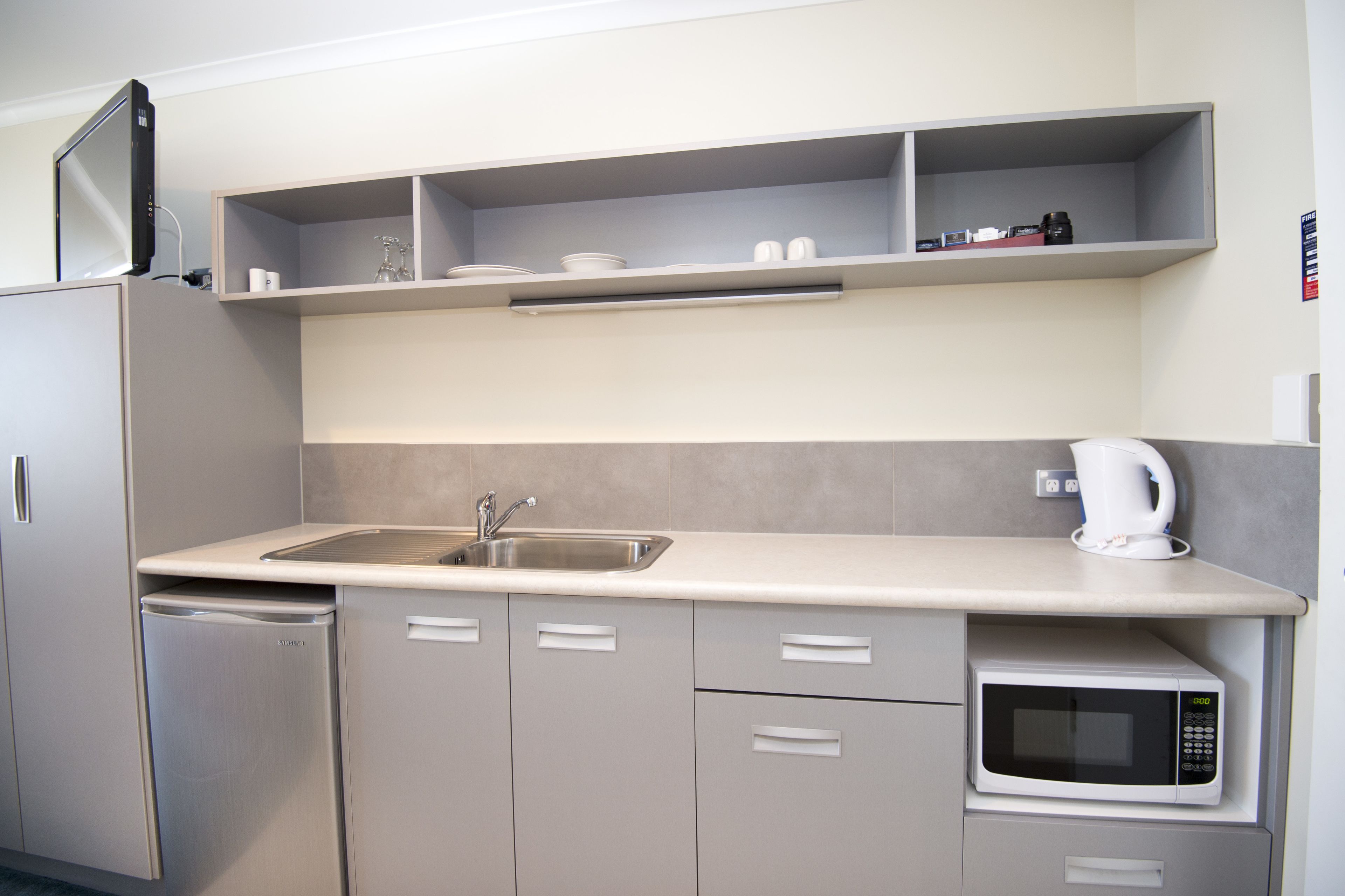 Fridge, microwave, electric kettle, cookware/dishes/utensils