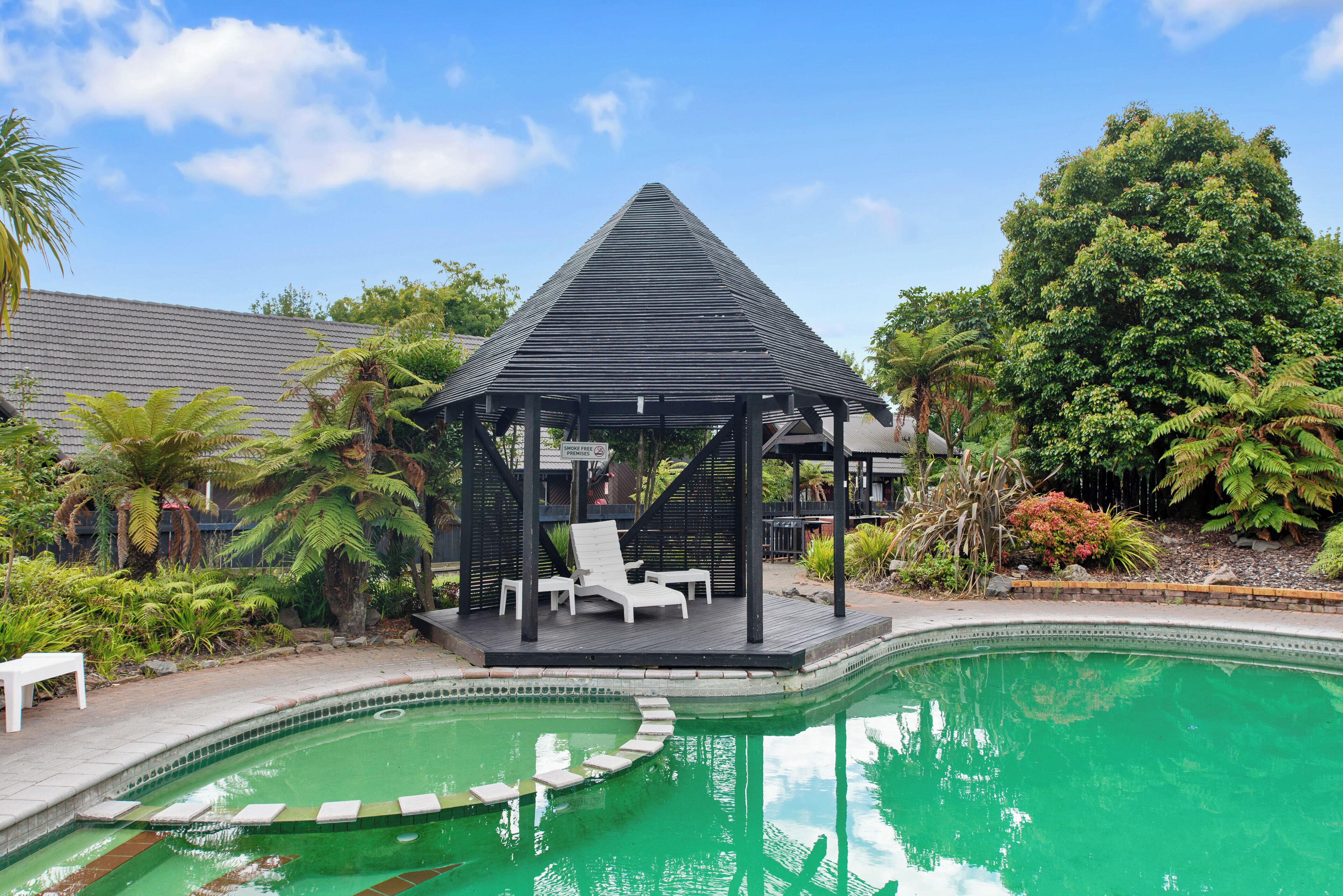 Outdoor pool, a heated pool, open 8:30 AM to 8:00 PM, pool loungers