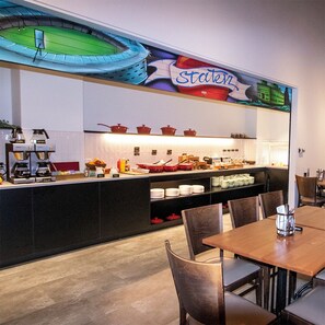 A restaurant with a counter, chairs, and a coffee machine. - Mercure Wellington Abel Tasman (Wellington)