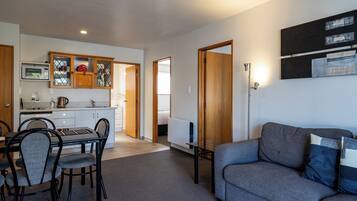 Two Bedroom Accessible Shower | Living area | 32-inch flat-screen TV with satellite channels, TV