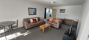 Two-Bedroom Apartment | Living area | 32-inch LCD TV with satellite channels, TV - Fitzherbert Court Motel (Hokitika)
