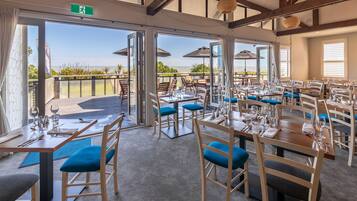 Breakfast, lunch, dinner served; beach views