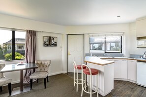 Deluxe One Bedroom Unit | Private kitchen | Fridge, electric kettle