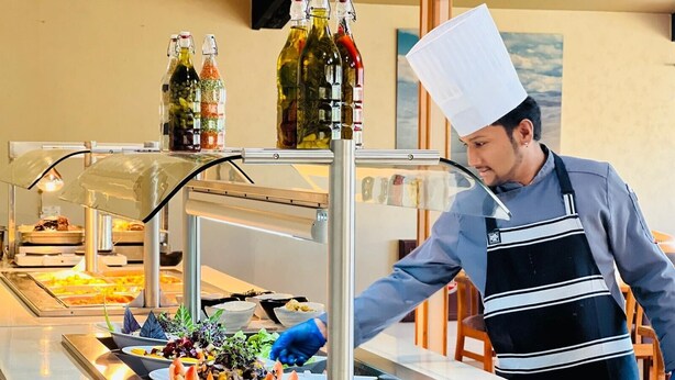 A buffet setup with various food items and condiments. - Distinction Heritage Gateway Hotel (Omarama)