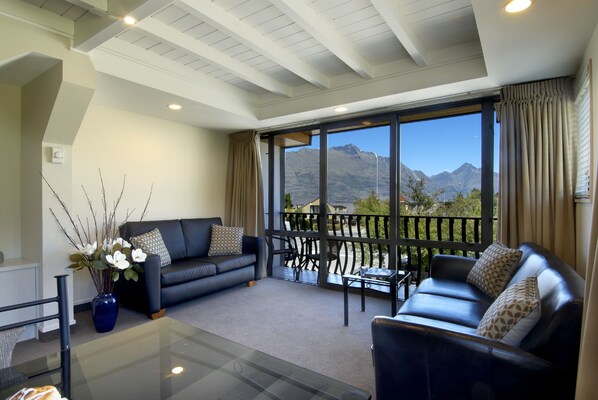 Apartment, 1 Bedroom | Living area | 36-inch LED TV with digital channels, TV, DVD player
