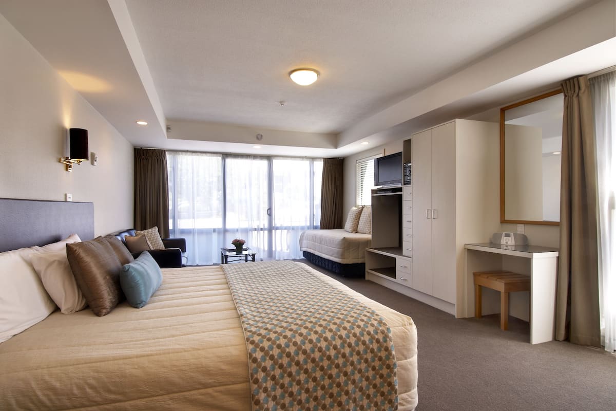 Executive Studio | Select Comfort beds, desk, blackout drapes, iron/ironing board