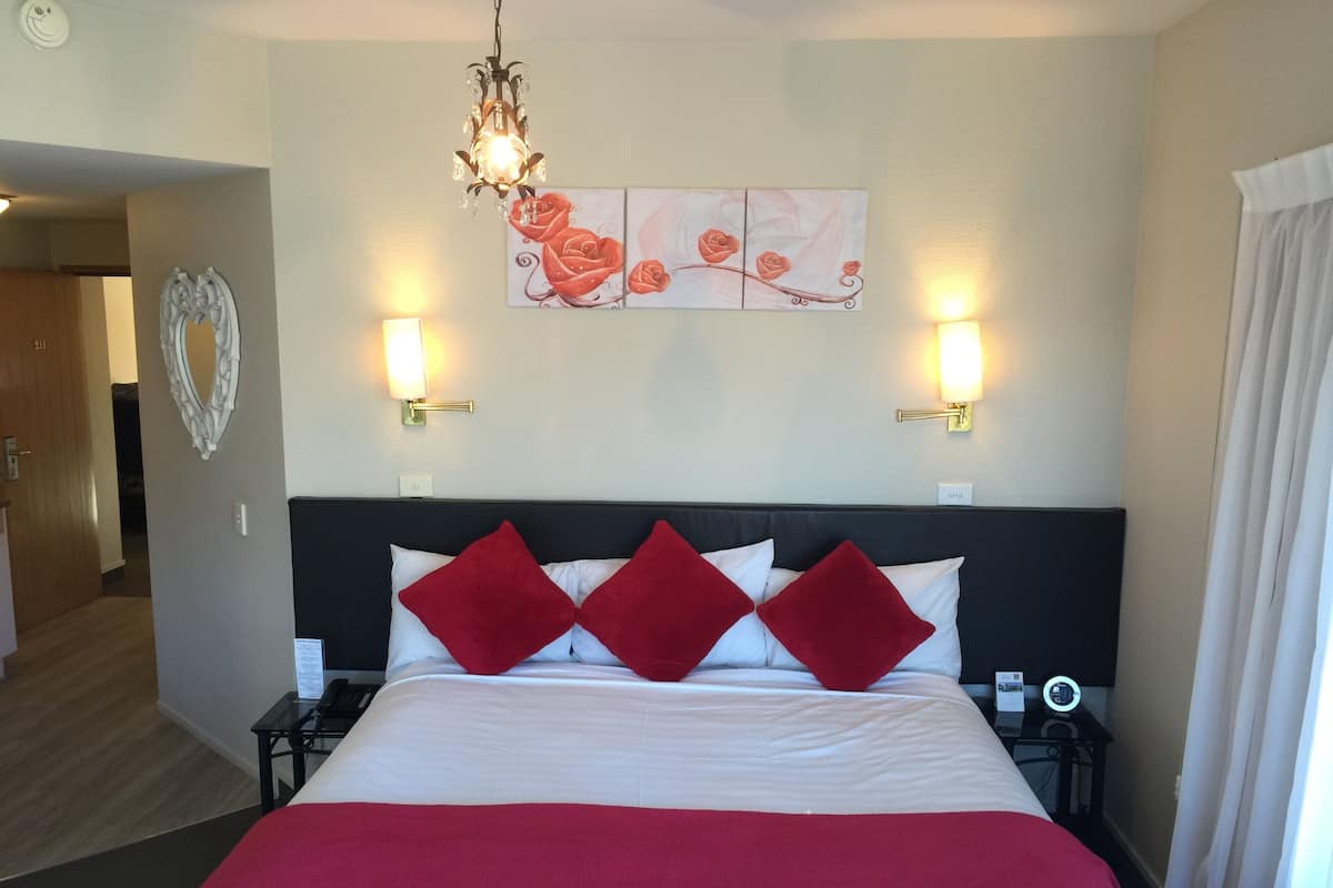 Honeymoon Suite | Select Comfort beds, desk, blackout drapes, iron/ironing board