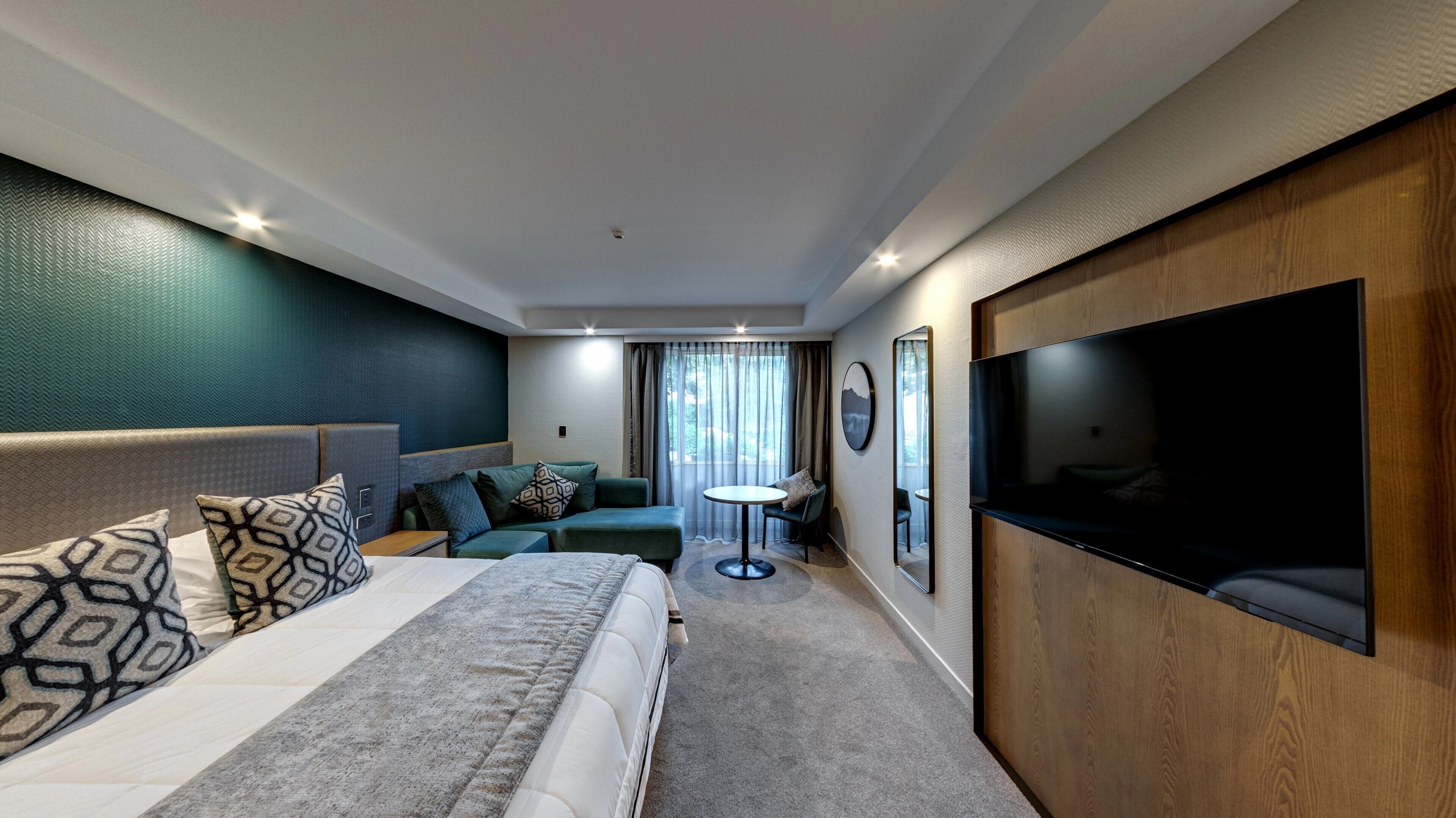 deluxe room, 1 king bed | in-room safe, iron/ironing board, free cots/infant beds, free wifi