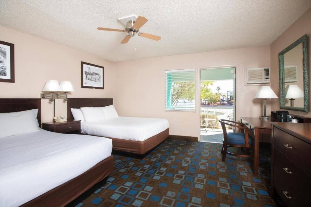 Premium bedding, pillow-top beds, desk, laptop workspace
