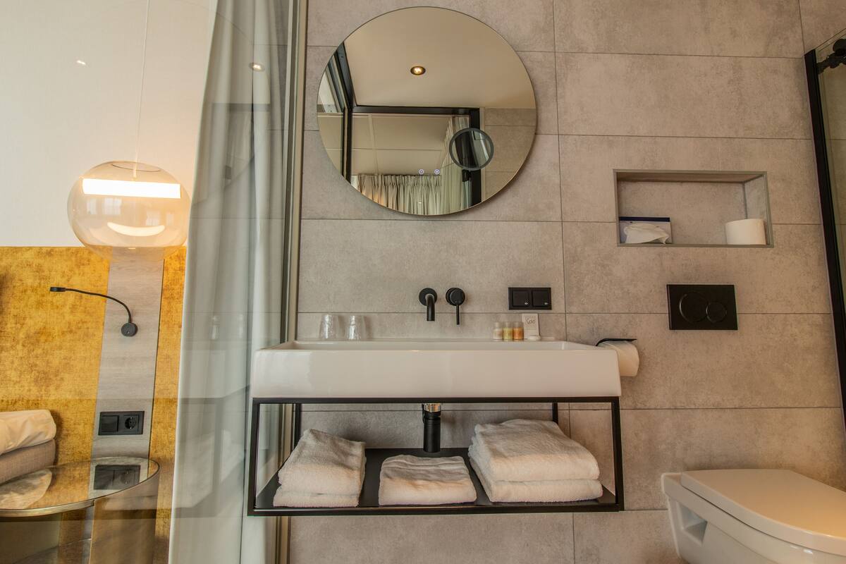 junior suite, 1 king bed, ocean view | bathroom | hair dryer, towels