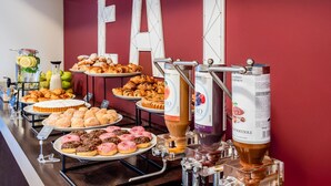 A buffet with various pastries and a coffee station. - B&B Hotel Firenze Novoli (Florence)
