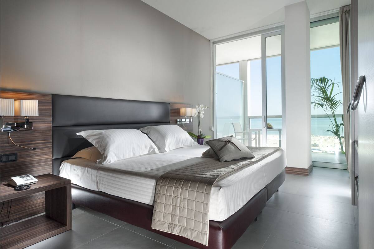 Deluxe Suite, Terrace, Sea View | Premium bedding, minibar, in-room safe, desk
