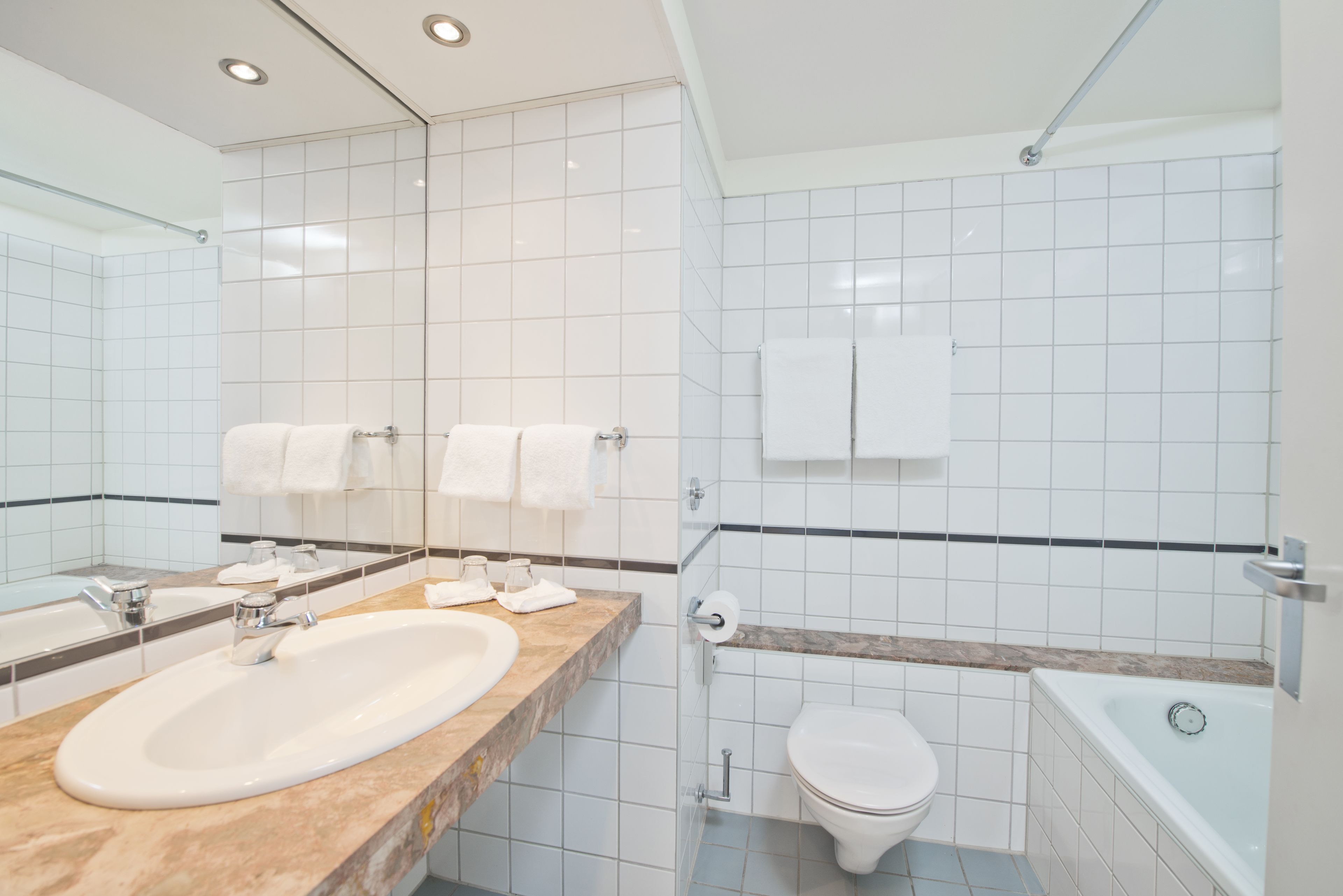 bathtub, hair dryer, heated floors, towels