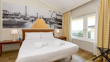 Junior suite, niet-roken | Bedden met traagschuimmatras, een kluis op de kamer, een bureau