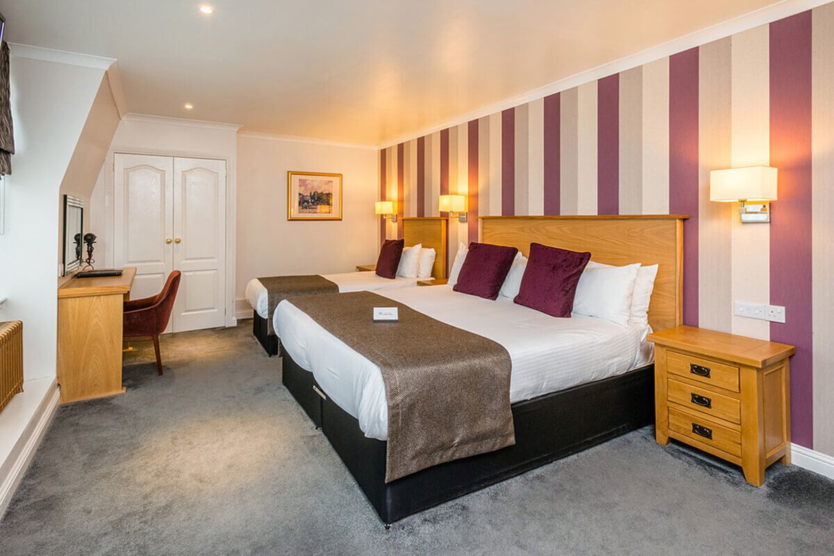 family room, multiple beds | 1 bedroom, desk, iron/ironing board, free wifi