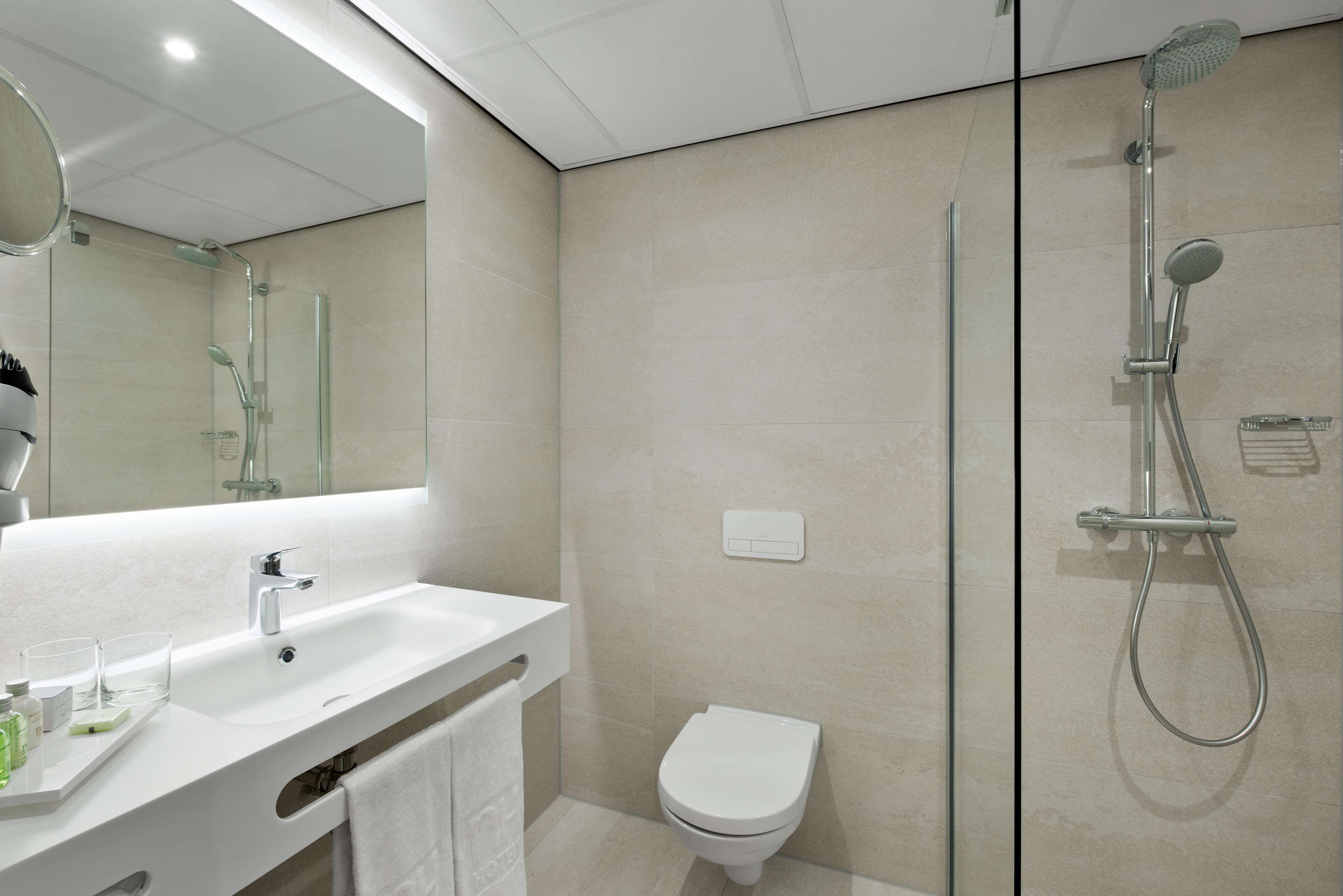 Shower, eco-friendly toiletries, hair dryer, towels