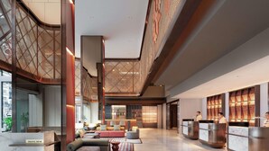 A spacious lobby with a travel desk, seating area, and a reception desk. - Grand Mercure Kuala Lumpur Bukit Bintang (Kuala Lumpur)