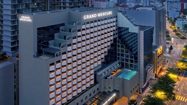A high-rise hotel with a grid of balconies, a prominent "Grand Mercure" sign, and a modern architectural design. - Grand Mercure Kuala Lumpur Bukit Bintang (Kuala Lumpur)
