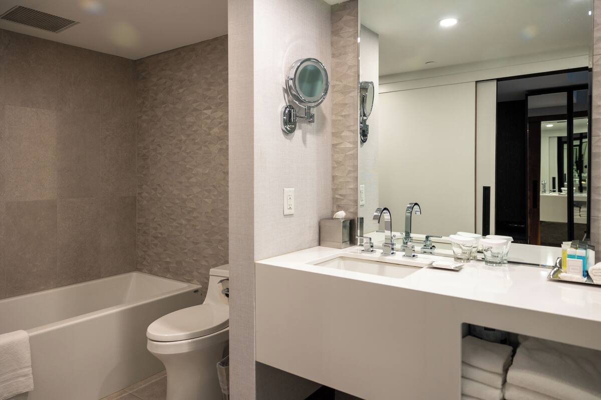 presidential suite | bathroom | combined shower/bathtub, designer toiletries, hair dryer, bathrobes