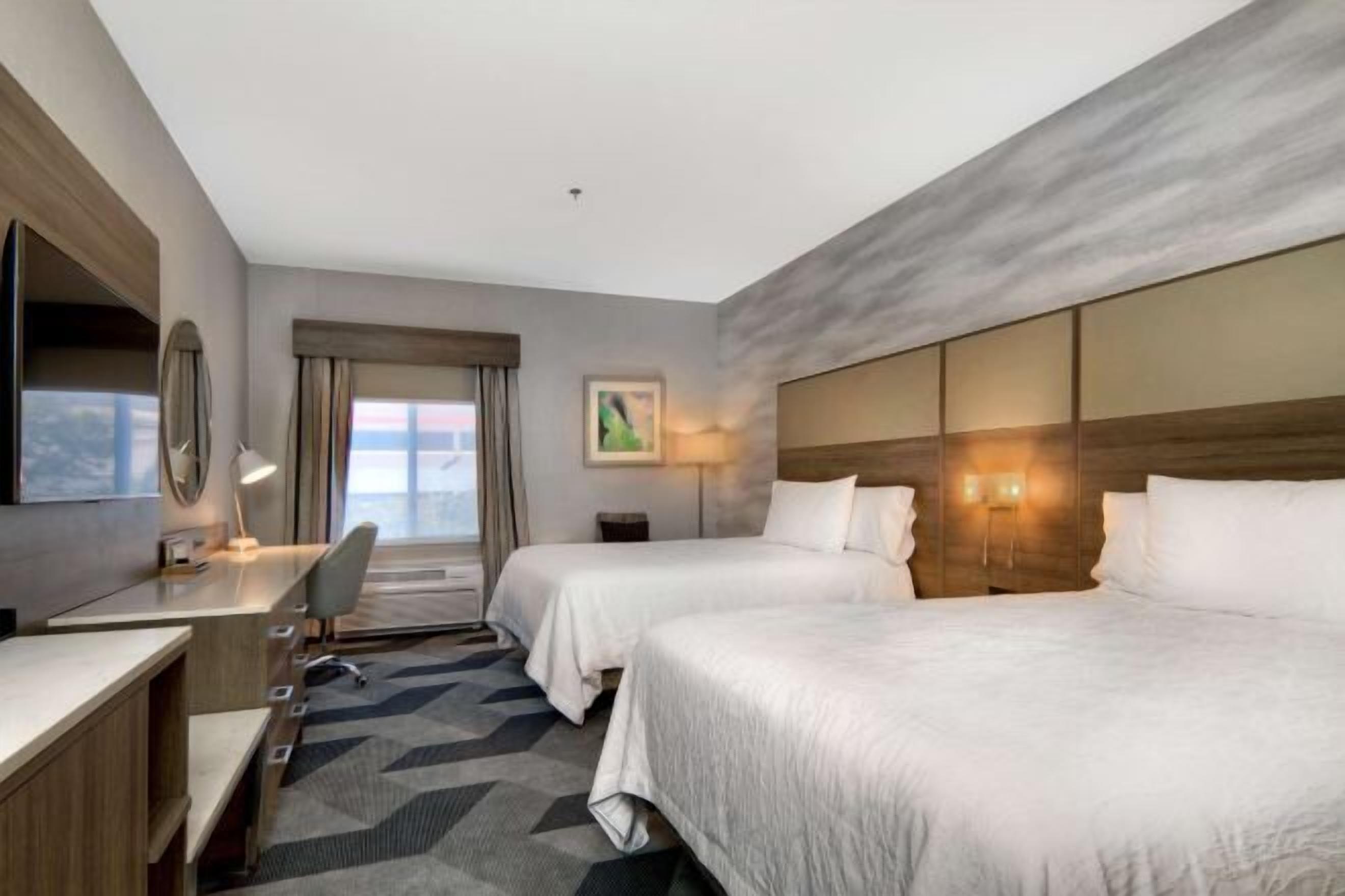 Desk, laptop workspace, iron/ironing board, free cribs/infant beds