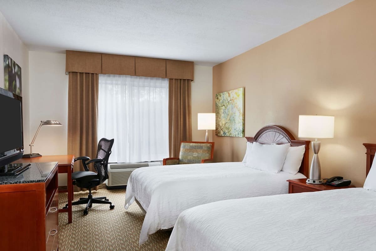 Premium bedding, desk, laptop workspace, blackout curtains