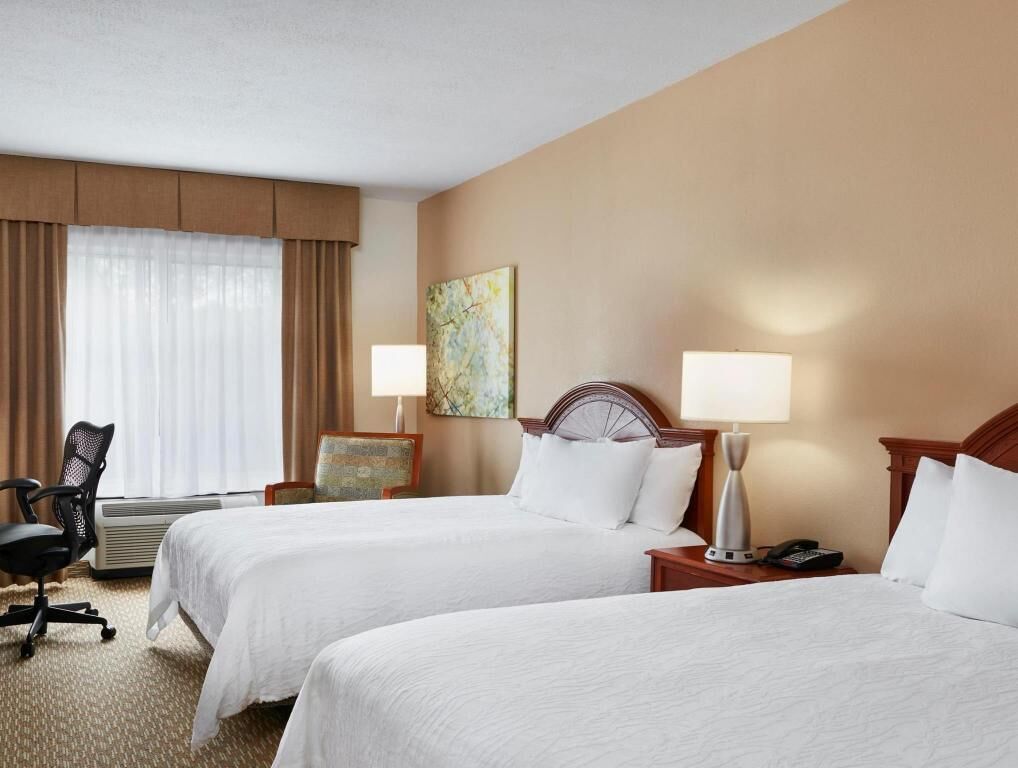 Premium bedding, desk, laptop workspace, blackout curtains